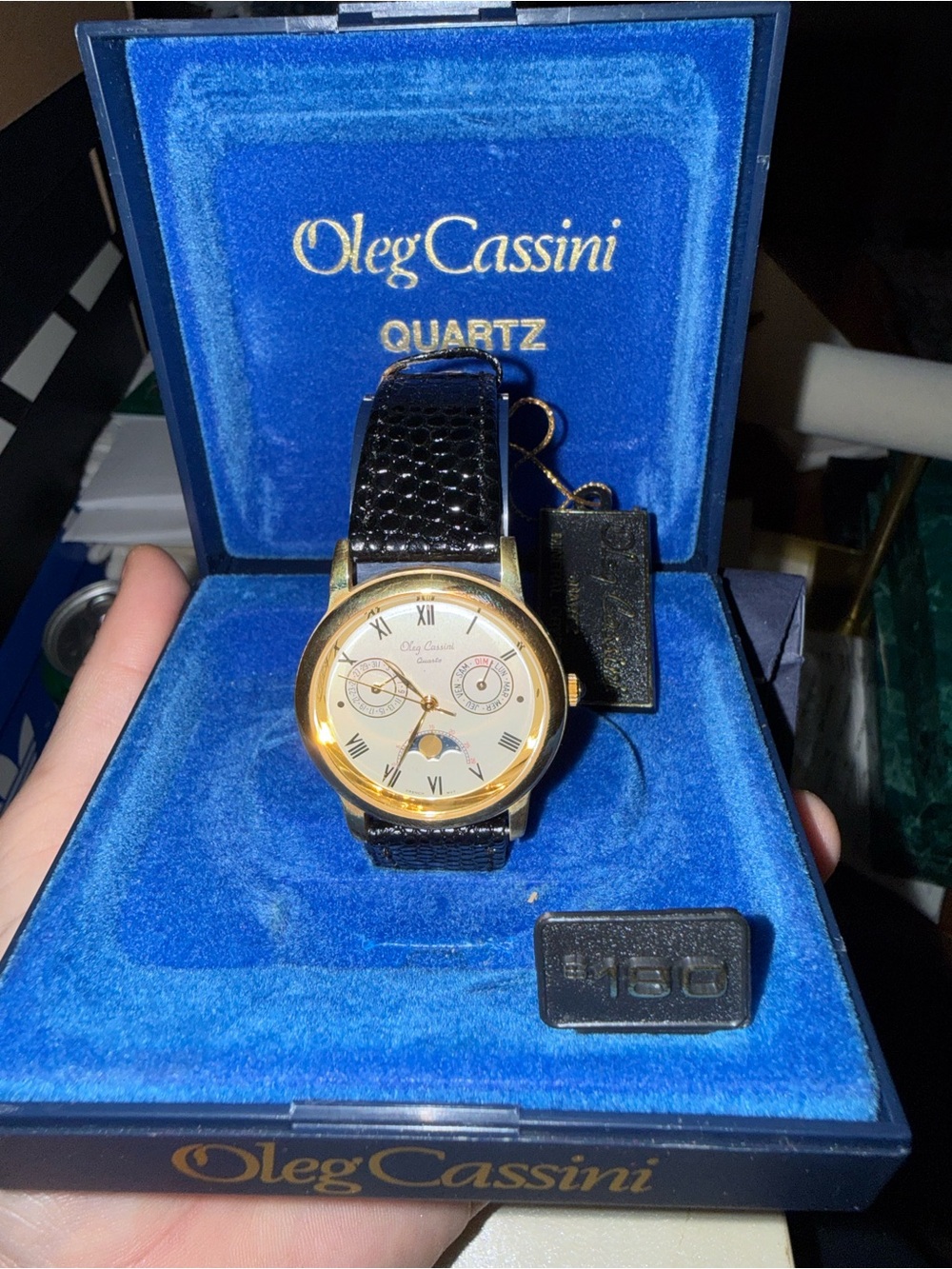 Oleg Cassini Gold Case Watch with Black Strap and Ivory Dial
